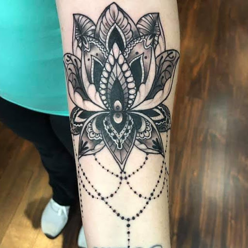 Explore tribal head tattoo ideas, creative tattoo ideas in Dubuque, available at The Crows Nest