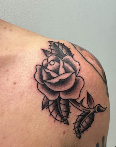 Explore upper back tattoo ideas for men, creative tattoo ideas in Springfield, available at Infinium Studios - Tattoos & Piercings