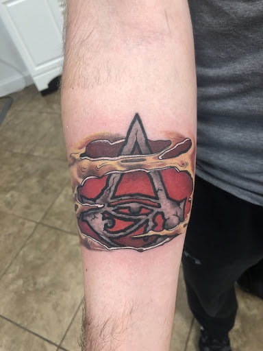 Explore leg tattoo cover up ideas, creative tattoo ideas in Lakeland, available at Lyons Den Tattoo Company