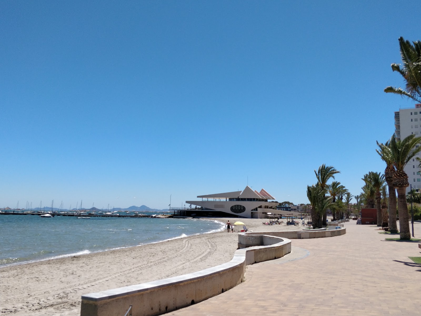 Foto von Playa de Colon mit blaues wasser Oberfläche