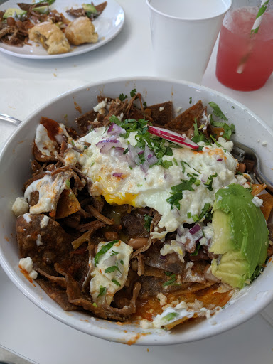 Chilaquiles with red sauce and barbacoa (loaded)