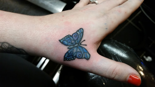 Explore daisy flower tattoo ideas, creative tattoo ideas in Erie, available at EliKingInk