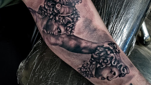 Explore kiss tattoo ideas, creative tattoo ideas in Whitehall, available at Legion Tattoo Gallery