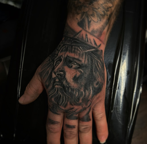 Explore men's inner bicep tattoo ideas, creative tattoo ideas in Medina, available at Greasers Ink