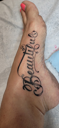 Explore mens script tattoo ideas, creative tattoo ideas in Talbott, available at Alpha Tattoo co.