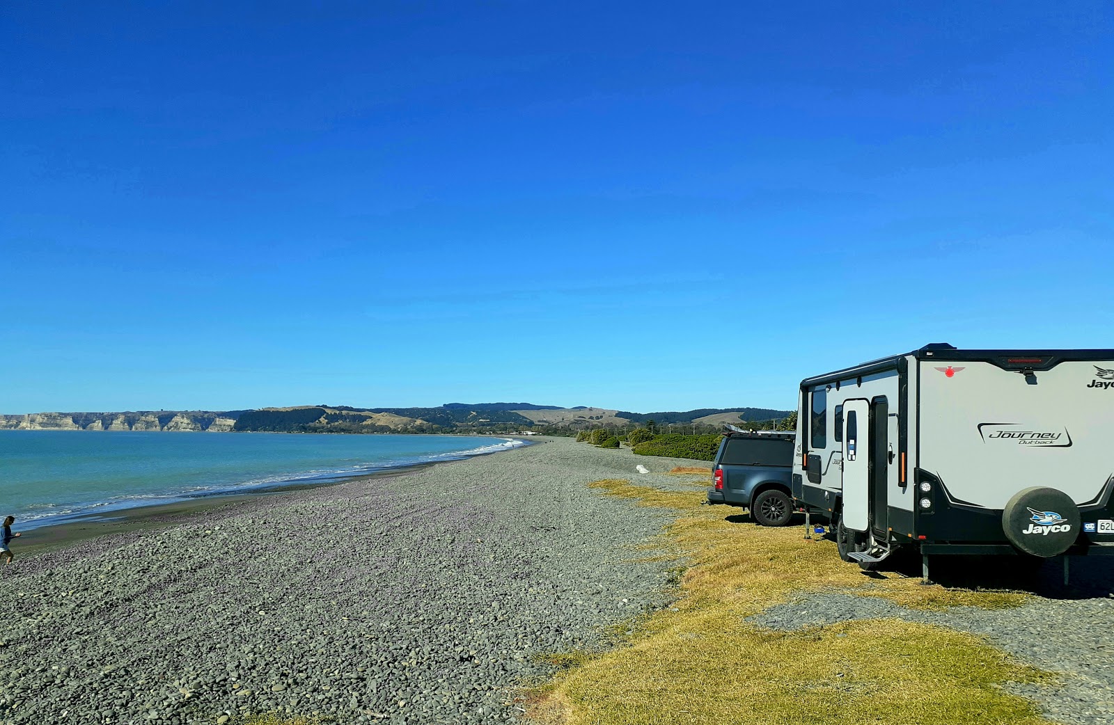 Foto di Haumoana Beach con una superficie del ciottoli grigi