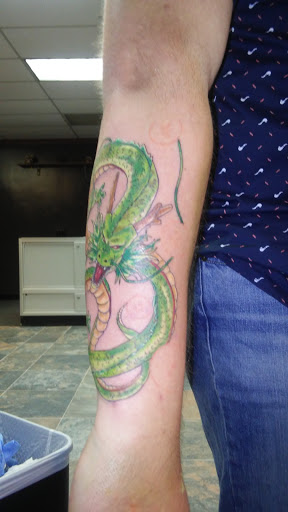 Explore inner bicep tattoo ideas, creative tattoo ideas in Mastic, available at Crystal Blue Tattoo