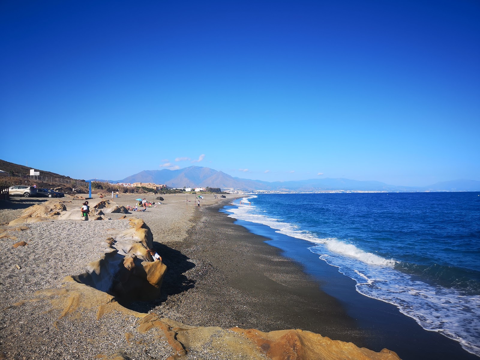 Fotografie cu Playa Aldea cu o suprafață de nisip gri