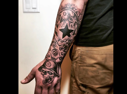Explore lower arm sleeve tattoo ideas, creative tattoo ideas in Scarsdale, available at Damm Nice Tattoo & Body Art