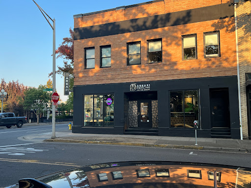 Find family tattoo ideas for moms for your next unique tattoo in Eugene at Area 51 Piercing