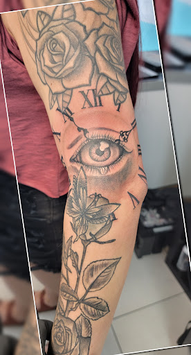 Find time clock tattoo ideas for your next unique tattoo in Saint Petersburg at Edens Apple Tattoos and Piercings