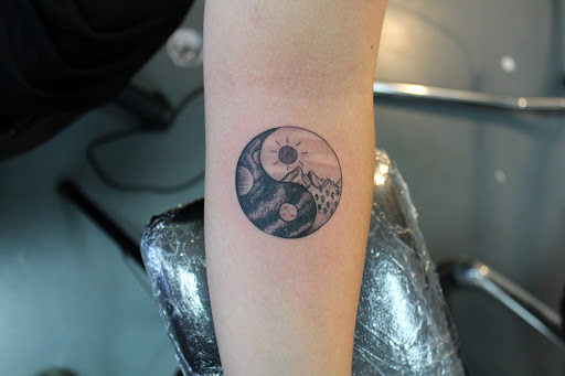 Explore skull hand tattoo ideas, creative tattoo ideas in Fort Myers, available at Tiger Lotus Tattoo and Piercing