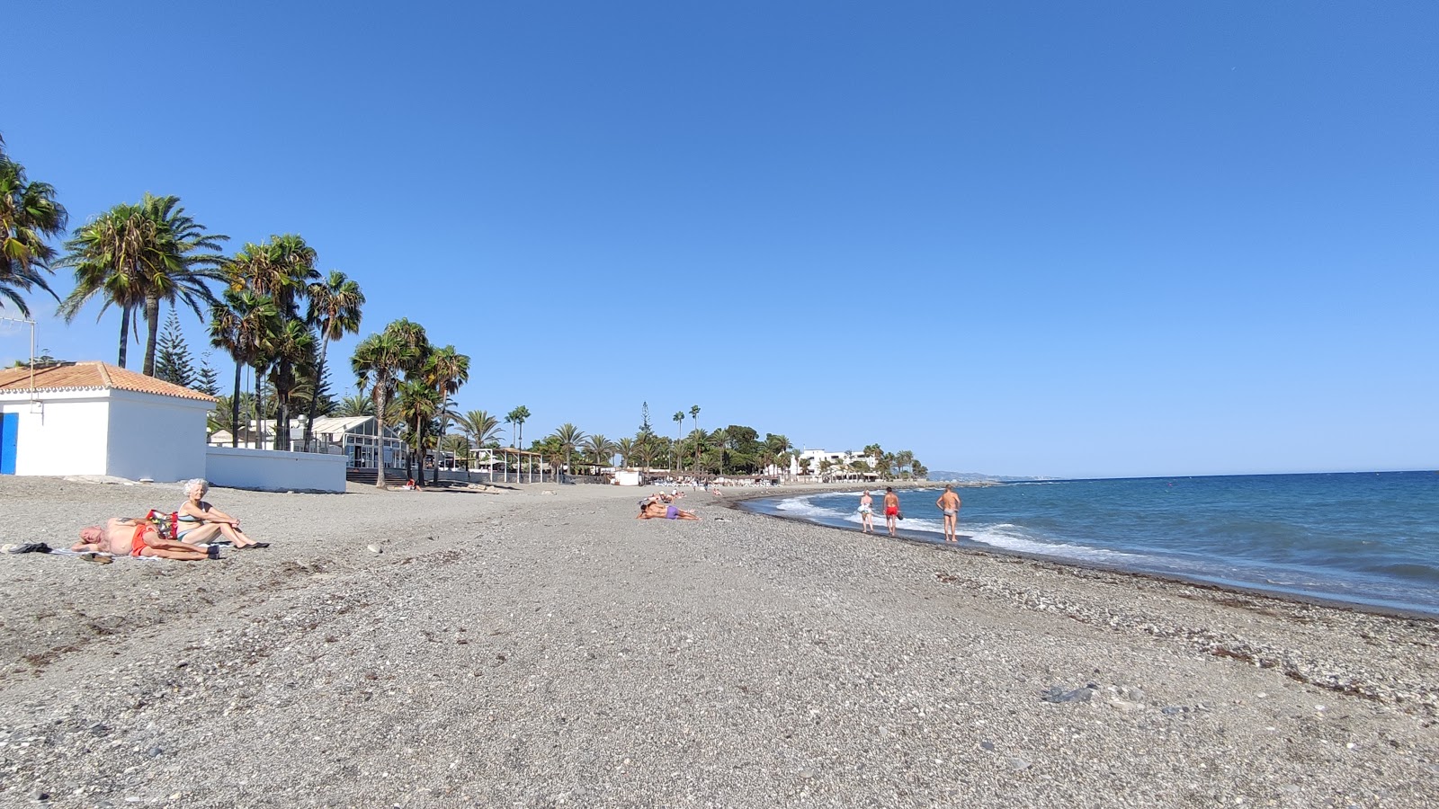 Foto di Playa de Cortijo Blanco con una superficie del ciottoli grigi