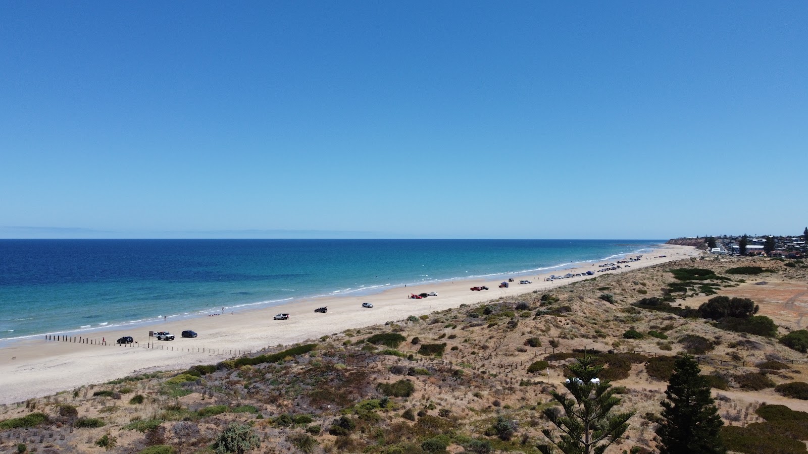Fotografija Moana Beach z svetel pesek površino