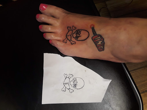 Explore under eye tattoo ideas, creative tattoo ideas in Newport, available at T N T Explosive Tattoo