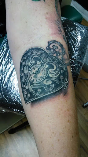 Explore tattoo ideas on leg for men, creative tattoo ideas in Owosso, available at Expressions Body Art Studio