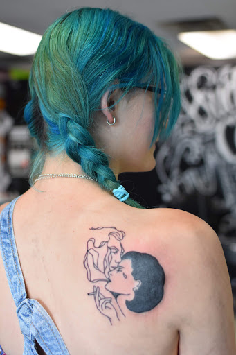 Explore negative space tattoo ideas, creative tattoo ideas in Sanford, available at Hudson & Company Tattoo Studio