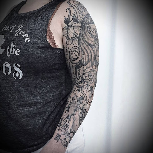 Explore front thigh tattoo ideas for women, creative tattoo ideas in Ambler, available at Tattoo GalaxyAmbler Piercing & Custom Tattoos