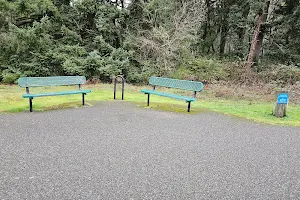 Two benches and a bike rack image