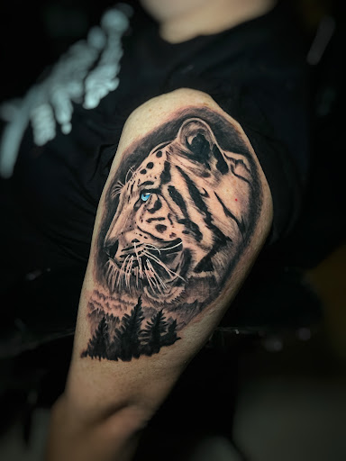 Find tattoo ideas under breast for your next unique tattoo in Cape Coral at South of Heaven Tattoo