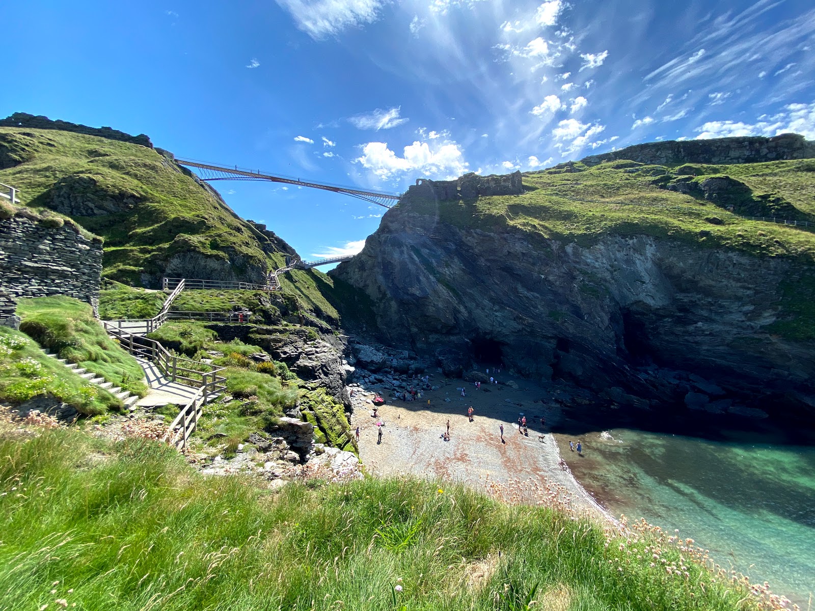 Photo of Tintagel Beach with turquoise pure water surface