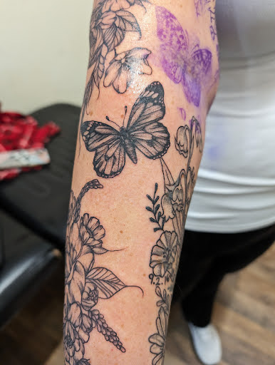 Explore female tattoo ideas with meaning, creative tattoo ideas in Cornelia, available at Prismatic Pulse Tattoo
