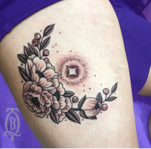 Explore strawberry tattoo ideas, creative tattoo ideas in Marietta, available at The Queen Bee Tattoo and Piercing Parlour