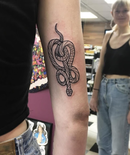 Explore 2 face tattoo ideas, creative tattoo ideas in Milwaukee, available at Bay Street Tattoo Co.