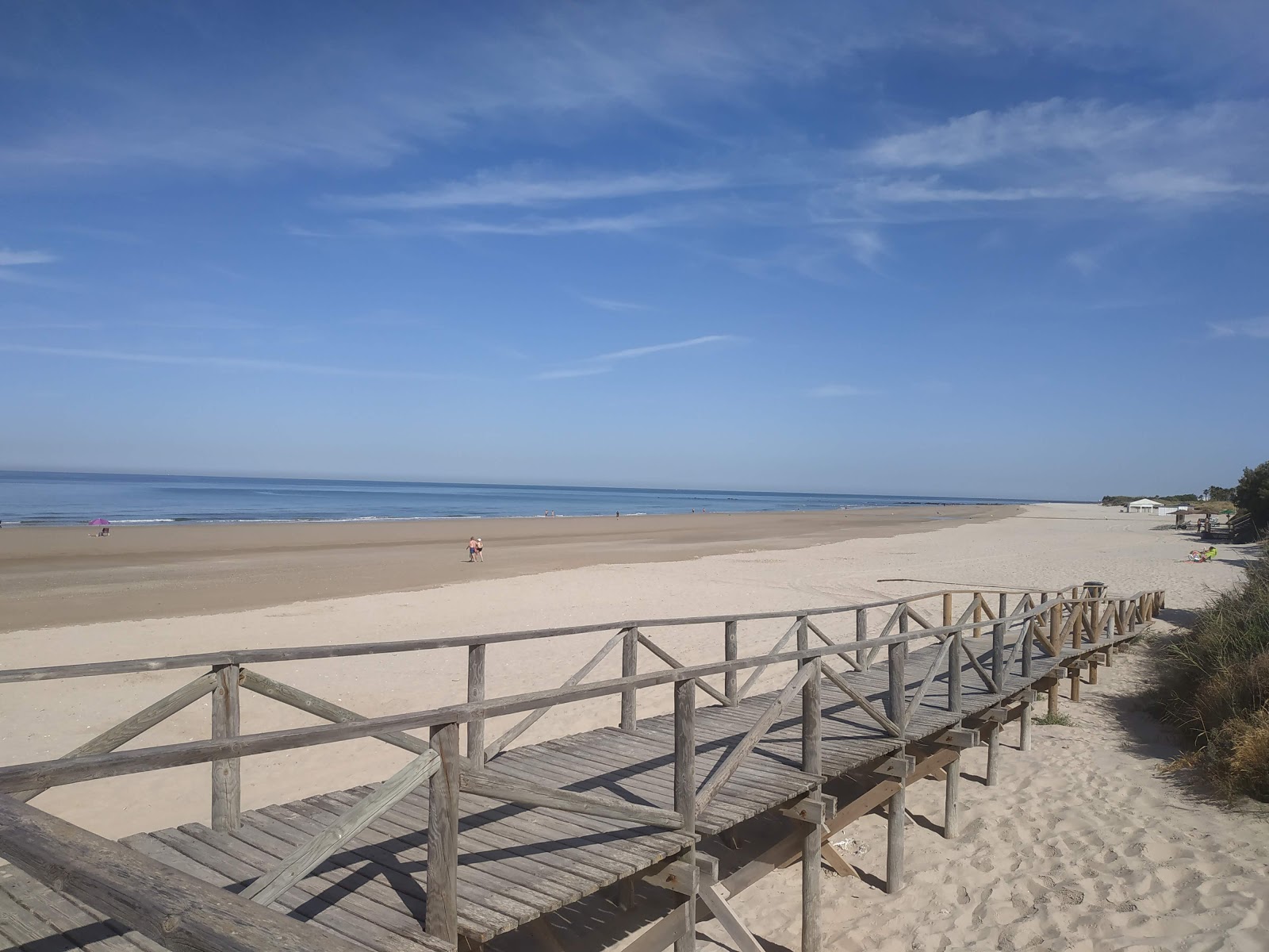 Foto de Playa de la Ballena con arena brillante superficie