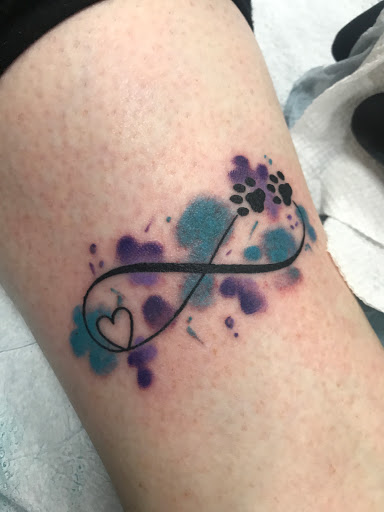 Explore dog paw tattoo ideas, creative tattoo ideas in Glendale, available at Old West Tattoo