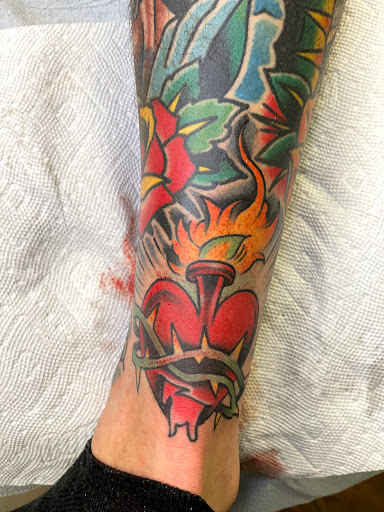 Find tattoo necklace ideas for your next unique tattoo in Delmar at Resolute Tattoo