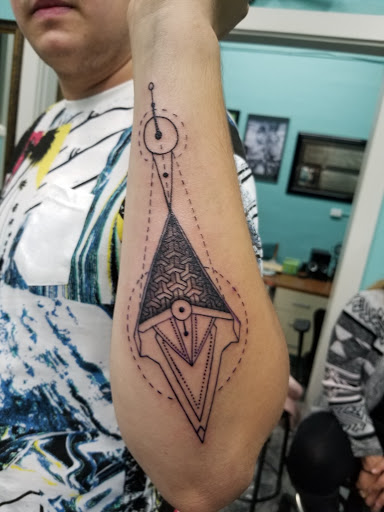 Find bracelet tattoo ideas for females for your next unique tattoo in North Liberty at Silver Rooster Tattoo