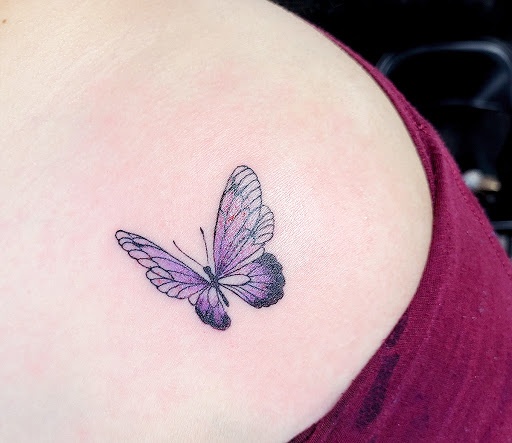 Find tattoo ideas under breast for your next unique tattoo in Nashville at Titan Tattoo