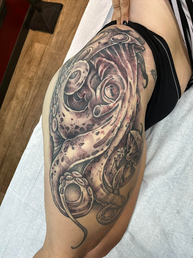 Explore solid black tattoo ideas, creative tattoo ideas in Joplin, available at The Raptor Collective