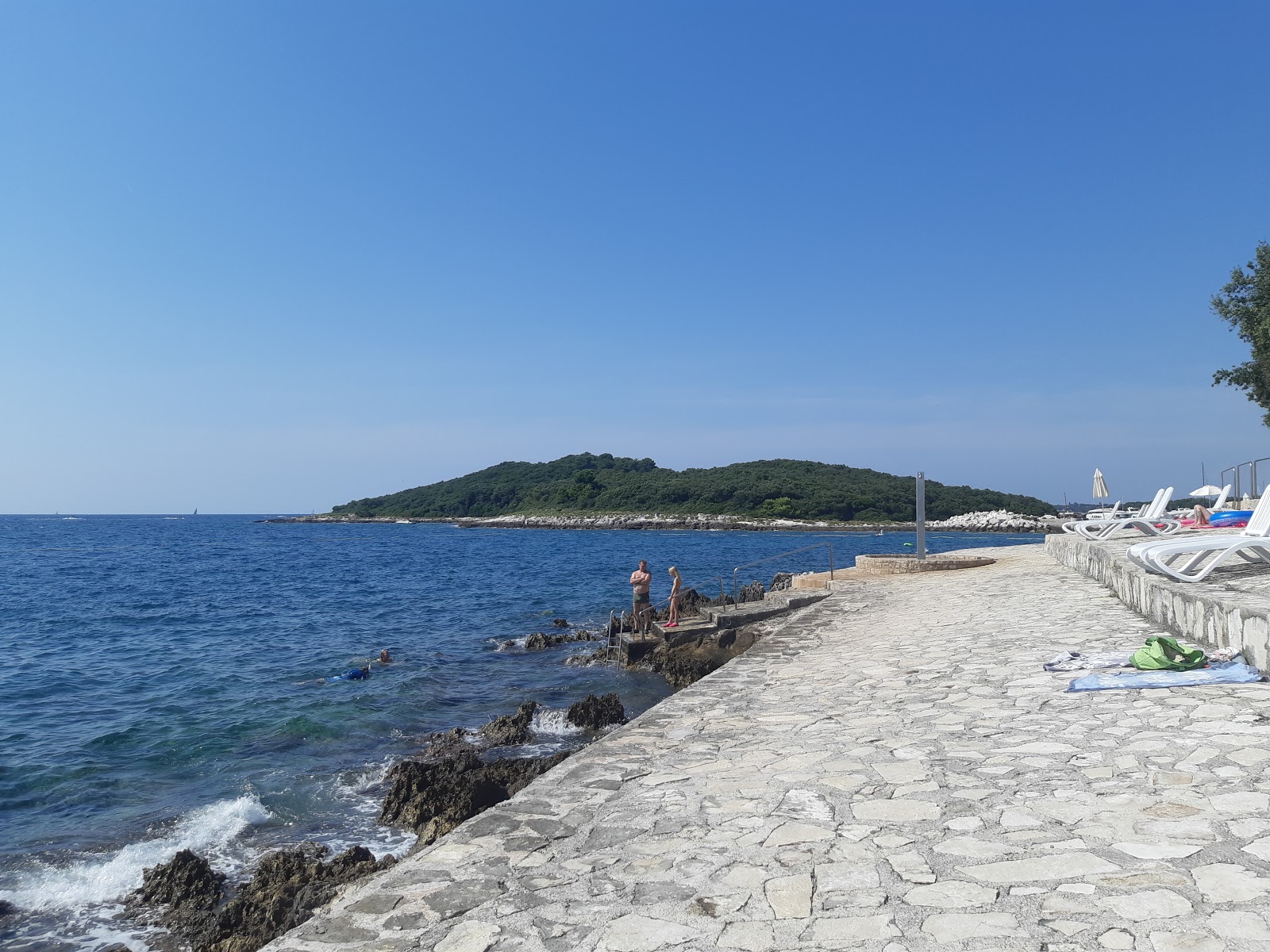 Porto Sole beach'in fotoğrafı küçük koy ile birlikte