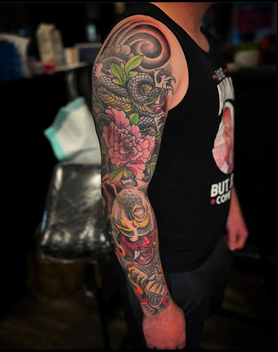 Explore cute flower tattoo ideas, creative tattoo ideas in Goose Creek, available at Red Kirin Tattoo