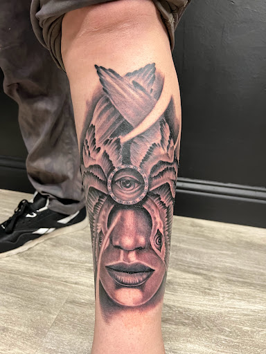 Explore leg tattoo ideas black male, creative tattoo ideas in Modesto, available at Ink Disciples Tattoo Parlor