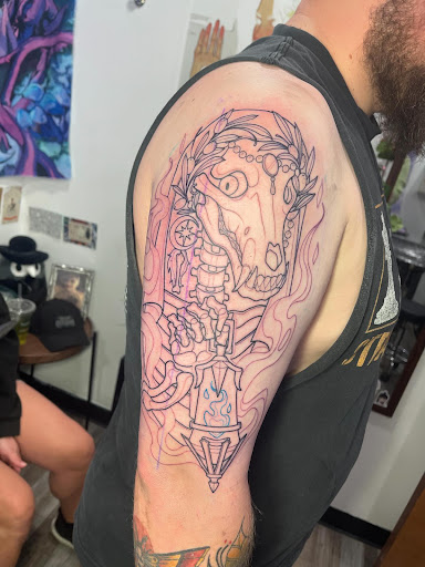 Explore flower back tattoo ideas, creative tattoo ideas in Jeannette, available at Damaged Legacy Studios