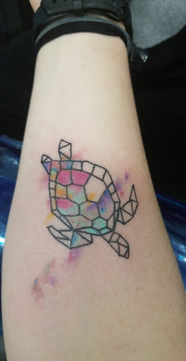 Explore feather tattoo ideas for men, creative tattoo ideas in Panama City Beach, available at Revolution Tattoo & Body Piercing