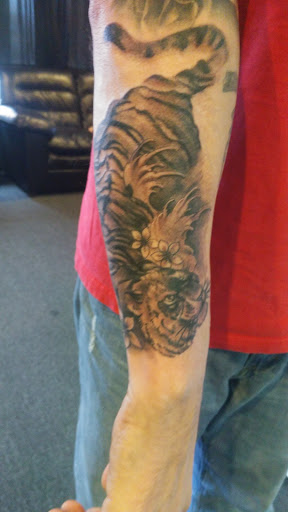 Find dino tattoo ideas for your next unique tattoo in Hagerstown at Tomahawk Tattoo MD