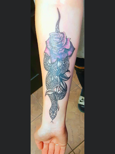 Explore rose foot tattoo ideas, creative tattoo ideas in Okeechobee, available at Muck City Tattoos & Piercings