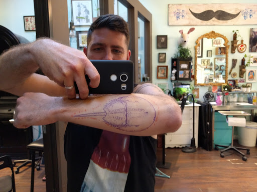 Explore mother and son tattoos ideas, creative tattoo ideas in San Diego, available at Buju Tattoo