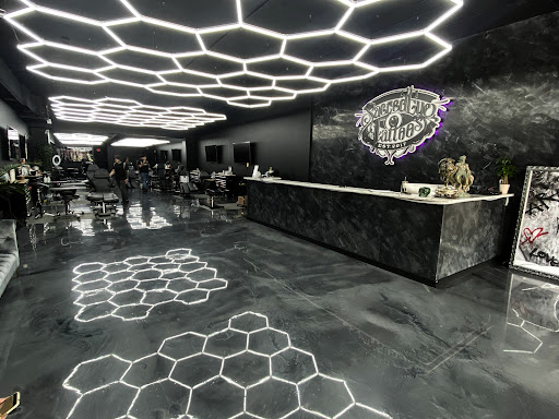 Explore barbell tattoo ideas, creative tattoo ideas in Hollywood, available at Sacred Eye Tattoos