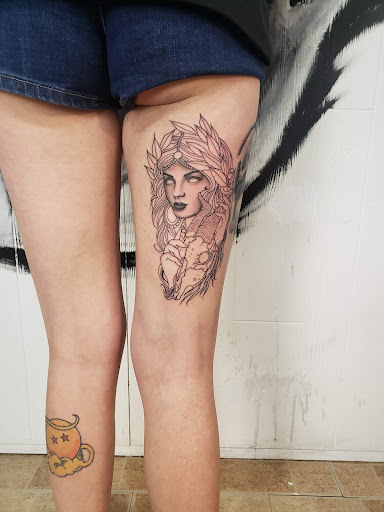 Explore tattoos behind ear ideas, creative tattoo ideas in Decatur, available at Exclusive Ink Tattoos & Body Piercings 22nd & Wood