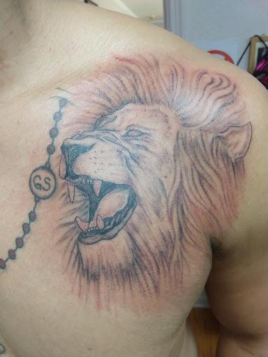 Explore rose cover up tattoo ideas, creative tattoo ideas in Overland Park, available at Inkslingers Tattoo Studio