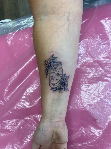 Explore cursive tattoo ideas, creative tattoo ideas in Lake City, available at Crooked Spines Tattoo Studio
