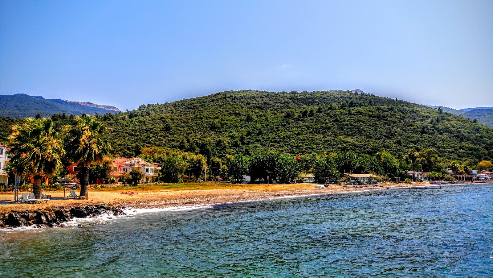 Foto av Guzelcamli beach med lätt sten yta