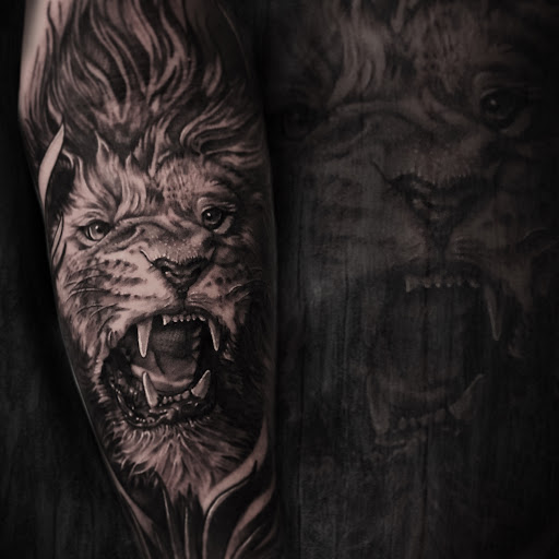 Explore wrestling tattoo ideas, creative tattoo ideas in Smyrna, available at Living the Dream Tattoo