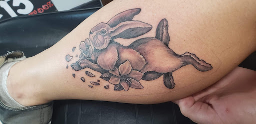 Explore under chin tattoo ideas, creative tattoo ideas in Ocala, available at Beauty in a Canvas Tattoo and Art Gallery