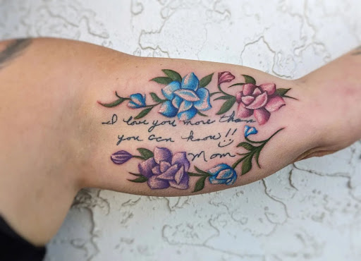 Explore cute behind the ear tattoo ideas, creative tattoo ideas in Dothan, available at Dinosaur Tattoo Company